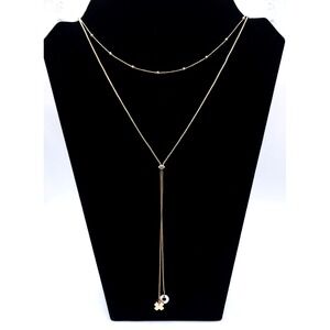 Demdaco Gold Tone Double Strand Lariat Necklace XO Clover Charm
